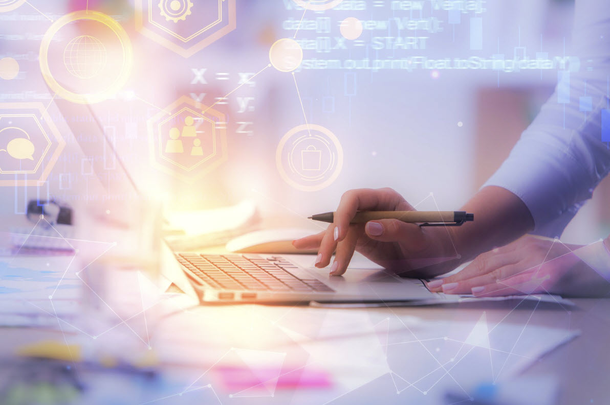 Hands typing on laptop with technology visualization